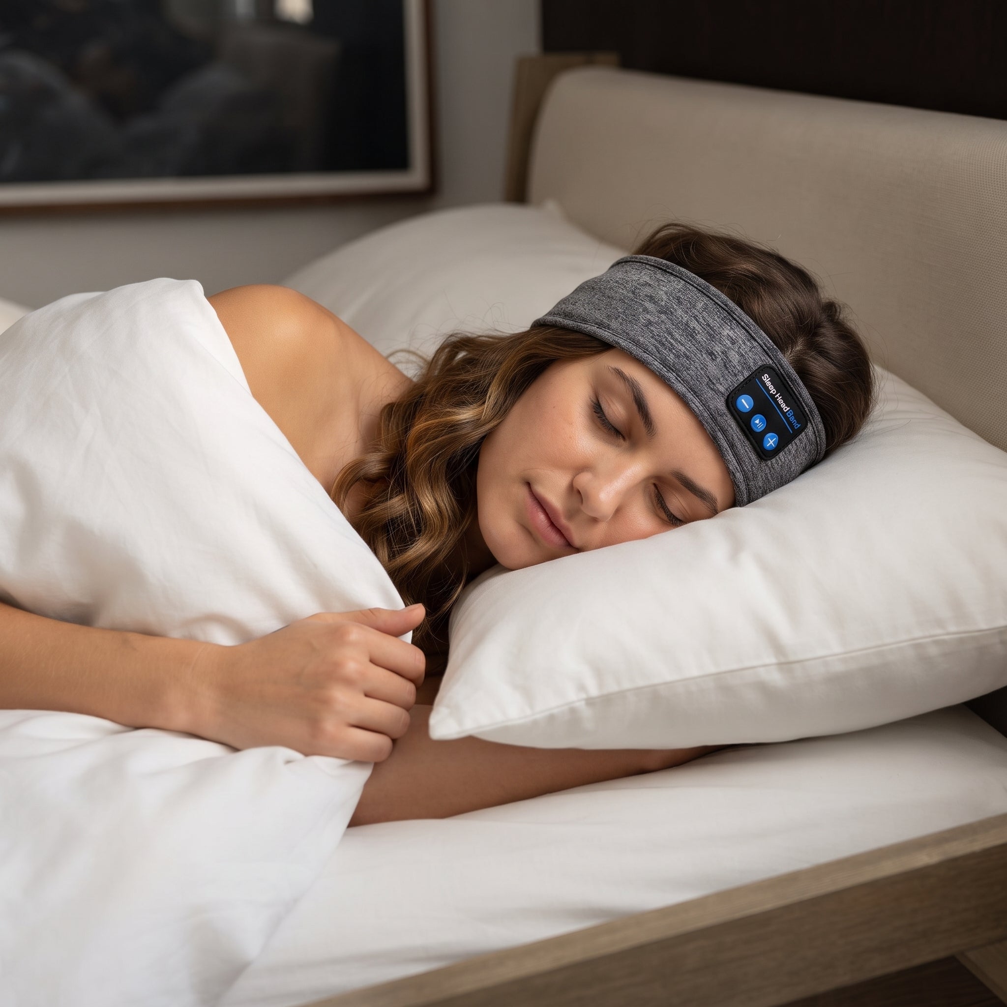 Woman side-sleeping on a pillow wearing the charcoal band